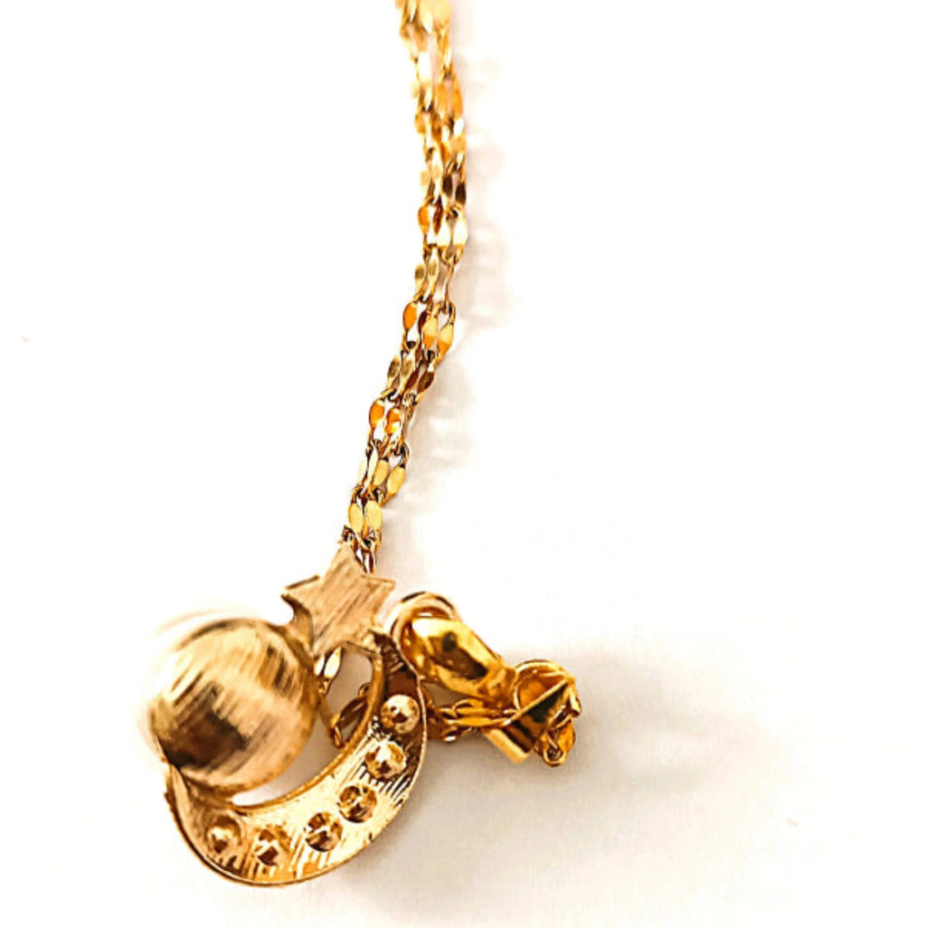 Collier doré avec pendentif étoile et perle